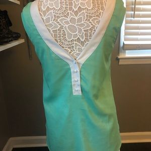 Sleeveless mint blouse with white trim
